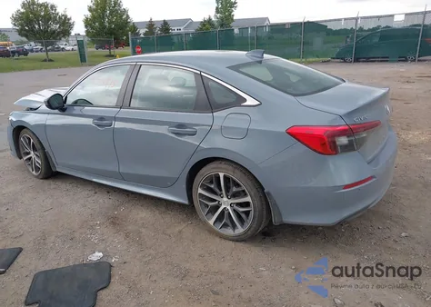2022 Honda Civic Touring z USA, uszkodzony, nr VIN 2HGFE1F94NH313631